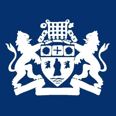 White heraldic crest with two lions holding a shield, topped with a chained crown, on a blue background.